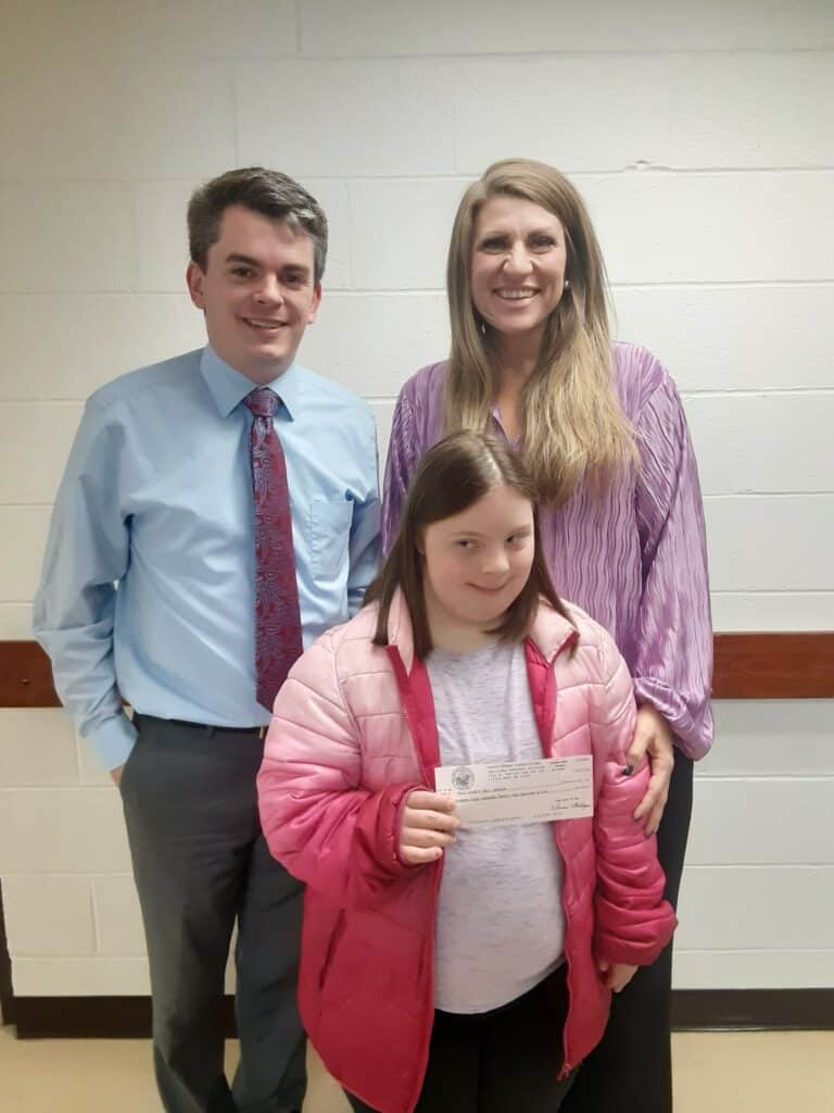 Pictured is Thomas Burchfield, Outreach Manager for Auditor of State Dennis Milligan’s office, Bethany Hughes, Executive Director of the Polk County Developmental Center, and Amy Thompson, a client of the facility.